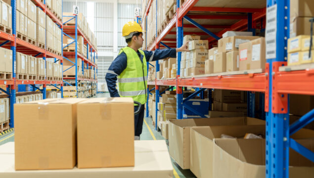 Asian male factory manager inspect goods in warehouse or inventory and check stock product. Transport logistic business shipping, delivery to customers through a freight forwarding company. inspection